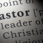 a boy and a pastor